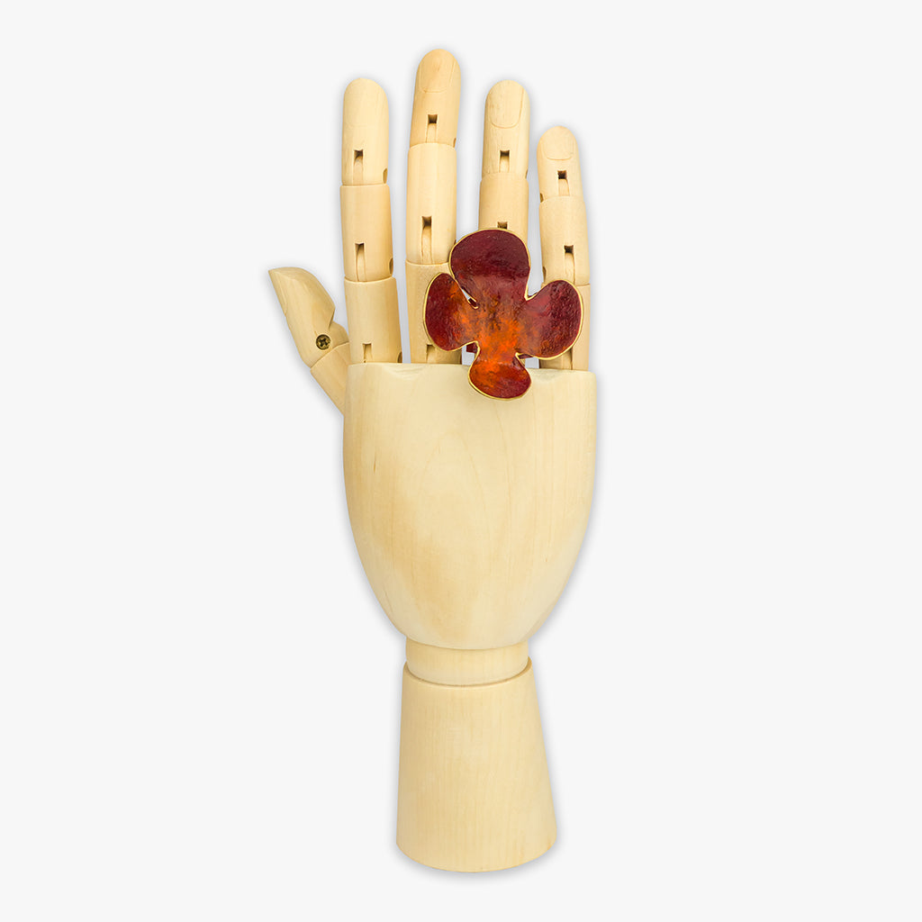 handmade 'blume' flower ring on hand in bordeaux / orange colour by dora haralambaki studio